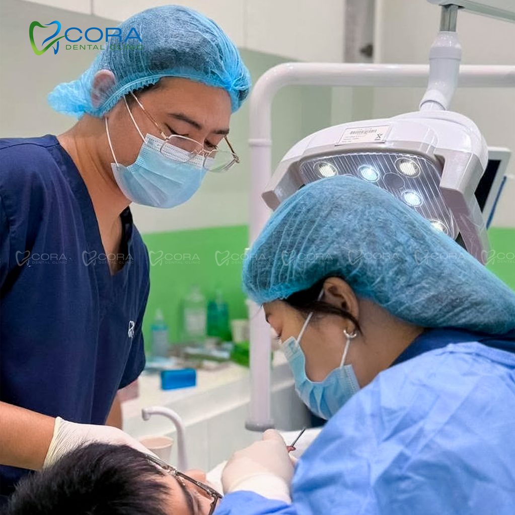 The Cora Dental team providing dental treatment to an adult patient in the clinic
